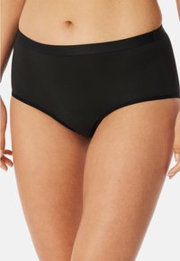 Zwarte high-waisted onderbroeken van gladde stof, met een brede elastische tailleband en zonder zichtbare naden voor een naadloze uitstraling.
