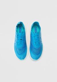 Sky blue athletic shoes with a mesh upper and contrasting lace details. Features a white sole and textured design throughout the material.