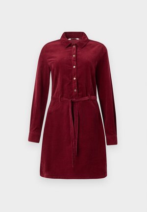 Burgunderfarbenes Corduroy-Hemd Kleid mit langen Ärmeln, knöpfbarem Vorderteil, Kragen und Taillengürtel. Verfügt über Seitentaschen und einen leicht ausgestellten Rock.