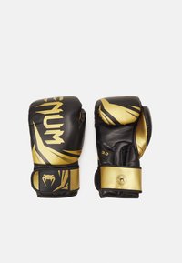 Black and gold boxing gloves made of synthetic leather, featuring a sleek design, bold graphics, and a secure wrist strap for support.