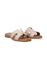 Beige Rutschen-Sandalen aus weichem Leder, mit zwei breiten Riemen mit Ausschnitten und einer niedrigen, strukturierten braunen Sohle.