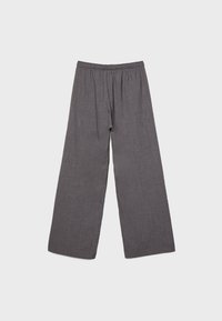 Pantalon gris foncé à jambes larges avec une taille élastique, en tissu léger, présenté à plat sur un fond clair.