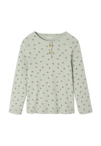 Light green ribbed long-sleeve shirt with small pink and blue floral pattern and two wooden buttons on the round neckline.
