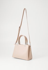 Beige handbag with a structured shape, made of textured leather, featuring two short handles and a removable adjustable shoulder strap.