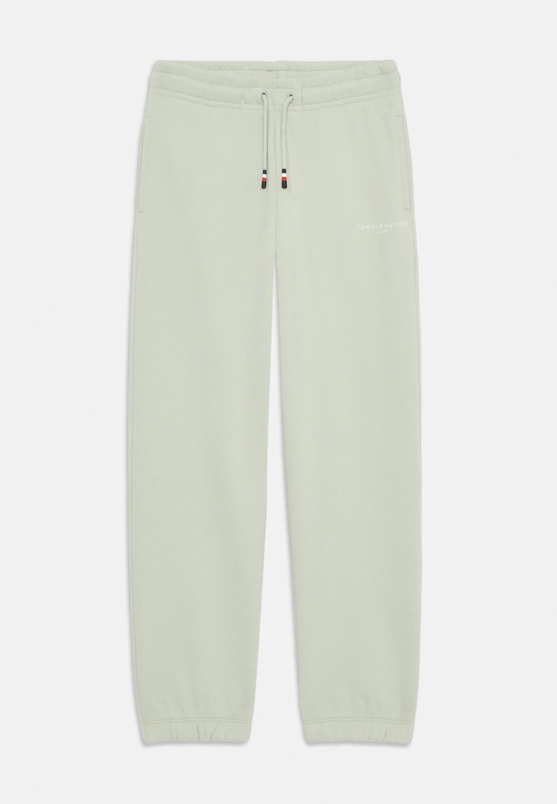 Ljusgröna träningsbyxor i mjukt tyg, med elastisk midja och dragsko, ribbade muddar och en vit logotyp.