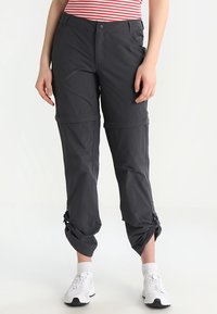 Mörkgrå zip-off byxor med en slät textur, knäppning med knapp och justerbara muddar. Har sidofickor och en smal passform.