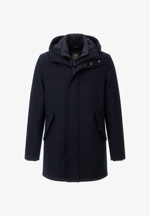 Granatowy płaszcz z kapturem zapinany na zamek, z dwoma kieszeniami po bokach i guzikami jako akcentami. Posiada pikowaną wewnętrzną podszewkę dla dodatkowego ciepła.