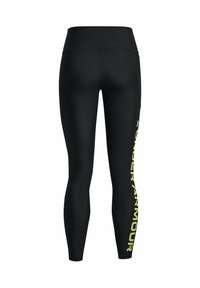 Czarne legginsy z wysokim stanem i dopasowanym krojem. Wykonane z elastycznego materiału, z odważnym żółtym logo "Under Armour" na boku.
