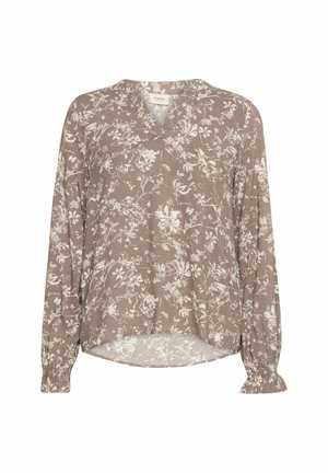 Hnědá blůza s květinovým potiskem v krémové barvě. Má dlouhé rukávy se shromážděnými manžetami a výstřih do V. Lehká, splývavá tkanina.