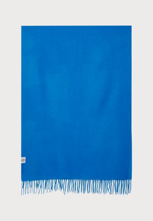 Blue rectangular scarf in soft fabric, featuring fringed edges. Labels attached at the bottom left corner.