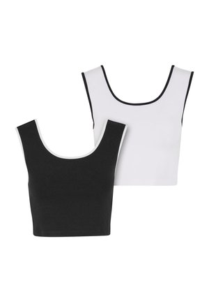 Zwei nahtlose Crop-Tops, eines schwarz und eines weiß, beide mit einem Rundhalsausschnitt und kontrastierenden Besätzen in Schwarz und Weiß, jeweils.