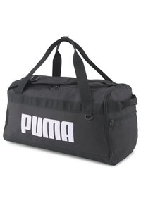 Black duffel bag made of durable fabric; features top zip closure, double handles, and a large white "PUMA" logo on the front.