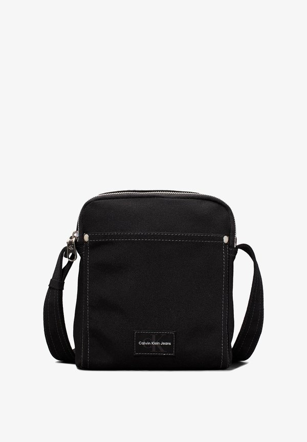 ESSENTIALS REPORTER - Cross body bag