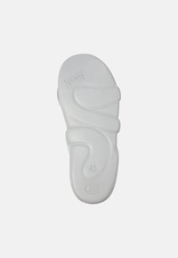 White rubber sandal with an ergonomic design, featuring a wavy strap pattern and size indicator "42" on the sole.