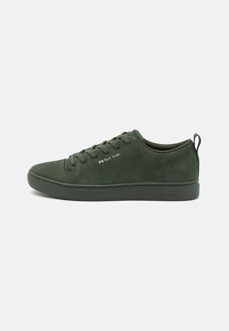 Green suede sneaker with flat lace-up design, padded collar, and contrasting logo on side. Rubber sole provides traction and support.