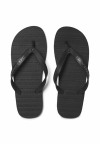 Ciabatte nere con suole in gomma testurizzata e cinturini sottili, con il nome del marchio "JACK & JONES" impresso sui cinturini.