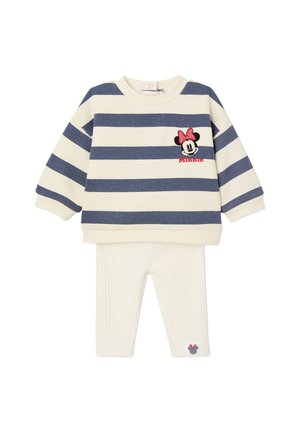 Gestreifter Pullover in Creme und Dunkelblau mit einem gestickten Minnie Maus Design; kombiniert mit cremefarbenen, gerippten Leggings, die ein kleines Detail aufweisen.