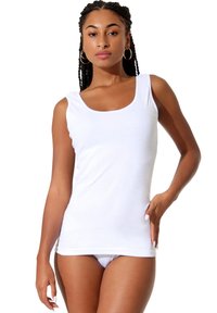 White tank top made of soft cotton material, featuring a scoop neckline and fitted design, with no additional patterns or embellishments.