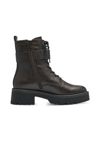 Stivale alla caviglia in pelle marrone con suola nera massiccia, design con lacci, cerniera laterale e cuciture a contrasto. Presenta un altezze media del gambale.