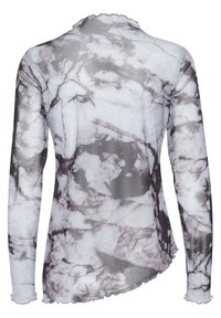 Långärmad topp i texturerat tyg med ett marmormönster i grått och vitt, med en scallopad nederkant och kanter.