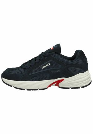 Men's athletic shoes made of dark blue mesh and suede, featuring a white midsole with red accents and black rubber outsole. GANT branding visible.