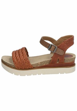 Brown leather wedge sandal with woven strap detail, adjustable ankle buckle, textured cork platform, and cream rubber sole.