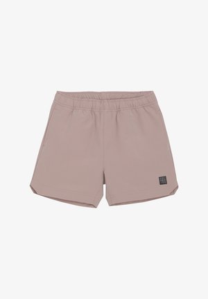 Shorts de sport rose clair en tissu lisse, avec une taille élastique et deux poches latérales, ornés d'une petite étiquette de marque à l'avant.