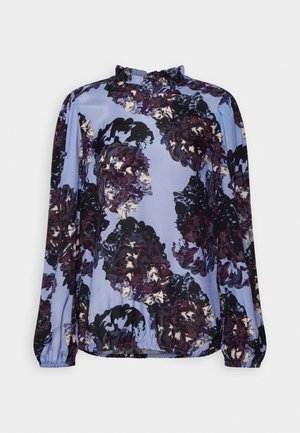 Long-sleeve blouse in light blue with dark floral pattern. Features a ruffled neckline and elasticized cuffs for added texture.