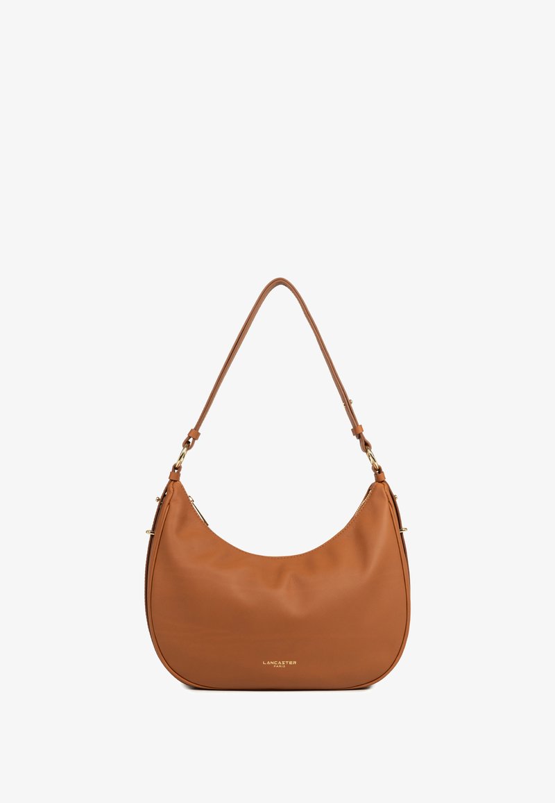 Borsa a tracolla in pelle marrone con una forma arrotondata, una singola tracolla e dettagli in metallo dorato. Presenta una superficie liscia e un logo discreto.