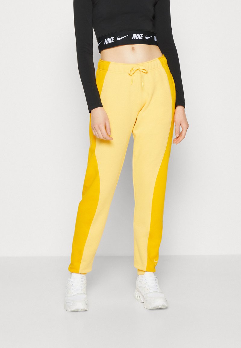 Nike Sportswear AIR Trainingsbroek topaz gold/university gold/geel