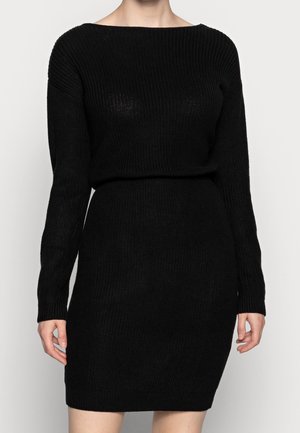 Vestito maglione nero lavorato a maglia con maniche lunghe, scollo rotondo e forma aderente. Presenta una texture a costine e una finitura liscia.