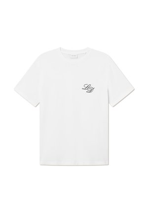 T-shirt en coton blanc avec un col rond et des manches courtes. Présente un petit logo noir "LD" sur la zone de la poitrine gauche. Texture lisse.