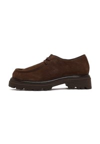 Brown suede lace-up shoe with thick, ridged sole and low heel, shown from the outer side on a white background.
