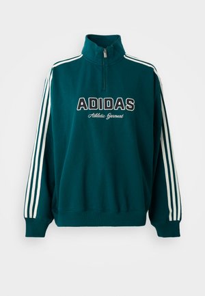 Tyrkysová mikina s vysokým golierom, biele logo Adidas a nápis "Athletic Garment"; s bielymi trojpruhovými akcentmi na rukávoch.