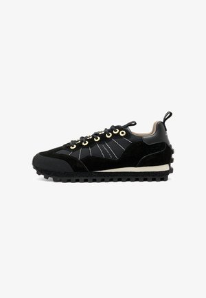 Black sneaker featuring a mix of suede and mesh materials, intricate stitching, gold eyelets, and a textured rubber sole.