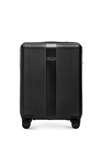 Black hard-shell suitcase with vertical ridges, four spinner wheels, and a central logo reading "WITTCHEN."