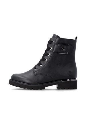 Black leather ankle boot with lace-up front, chunky sole, low heel, and decorative metal detail on the side.