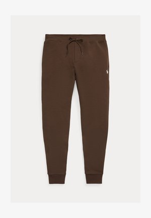Pantalon de jogging marron avec taille à cordon et poignets côtelés, avec un petit logo blanc brodé sur la cuisse droite.