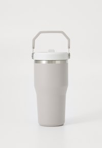 Gray insulated mug with a tapered shape, white lid, silver accent band, and a sturdy beige handle for easy carrying.