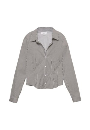 Camicia a maniche lunghe, tagliata, realizzata in tessuto leggero, con righe verticali bianche e nere, colletto a punta.