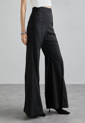 STRIPED FITTED FLARED TROUSERS - Bukse - black