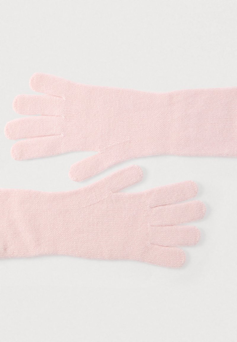 Rosa stickade vantar med en mjuk textur, som har fem fingeröppningar och en sömlös handledsdesign.