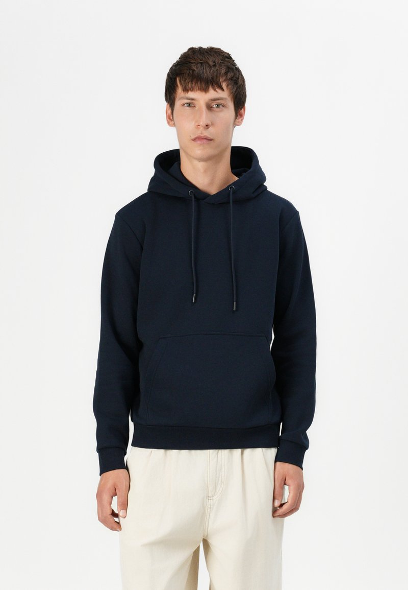 Navy blue hoodie in soft, textured fabric features a drawstring hood, front pocket, and ribbed cuffs and hem. Suitable for casual wear.