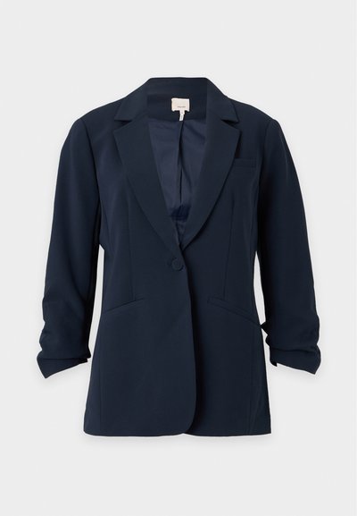Blazer bleu marine à un bouton avec revers crantés, deux poches avant et manches légèrement froncées, présenté sur un fond clair uni.