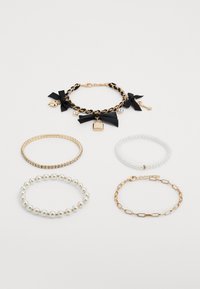 Gold-tone chain bracelet with black satin bows, lock charm, and rhinestones; four additional bracelets in gold, silver, and pearl finishes.