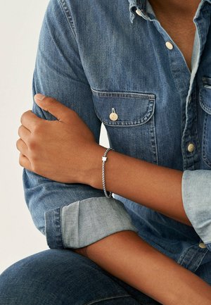 Bracciale Fossil da donna in ottone JA6775040 – JOY Gioielli