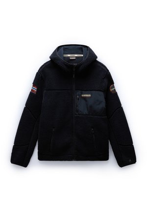 Fleece jacket in dark navy, featuring a textured outer, zippered pockets, and a contrasting black chest panel with logo and patch accents.