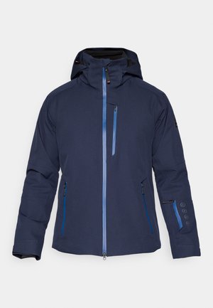 Ūdensnecaurlaidīga tumši zila jūras flotes krāsas jaka ar kapuci, kabatām ar rāvējslēdzējiem un zilām detaļām. Raksturo gluds piegriezums un regulējami aproces, lai nodrošinātu drošu aizvēršanu.