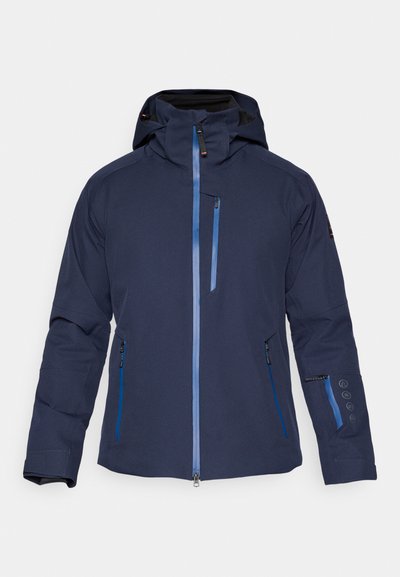 Tamsiai mėlynas vandeniui atsparus švarkas su gaubtu, kišenėmis su užtrauktukais ir mėlynais akcentais. Turi aptakų siluetą ir reguliuojamus rankogalius, skirtus geram užsidėtimui.