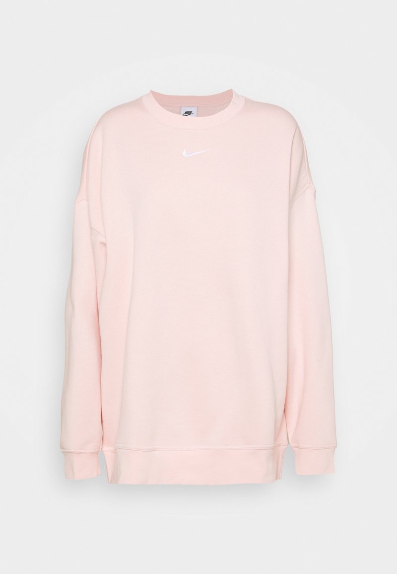 Ljusrosa sweatshirt gjord av mjukt tyg, med rundad halsringning och långa ärmar. Distinkt vitt Nike-logotyp på bröstet.